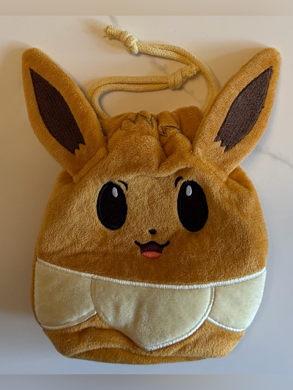 Pokemon Prismatic Evolutions Eevee Card Bag Plush